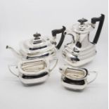 A Georgian style plain silver four piece tea and coffee service to include: teapot, coffee / hot