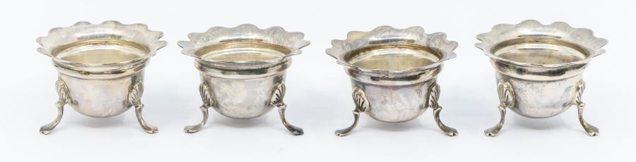 A set of four Edwardian silver salts, flared rims on three shell and trefid feet, hallmarked by - Image 3 of 5