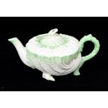 Irish Interest:  A Belleek 2nd period Neptune teapot and cover, the shell and coral body highlighted