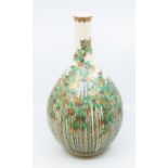 A Japanese satsuma ware large onion shaped vase, the entire decorated with bamboo canes and leaves