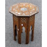 A late 19th century Ottoman octagonal sewing table, inlaid with mother-of-pearl stars and lozenges