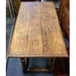 A late 17th Century oak table, oversailing triple planked rectangular top with moulded edge, above