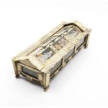 An early 19th century Napoleonic prisoner-of-war bone domino box, the arched top having three glazed