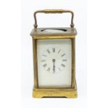 A 19th Century gilt brass carriage clock, white enamel dial with Roman numerals (AF)