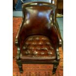 A 19th Century mahogany and studded leather armchair, shaped back with down-swept arms, drop-in