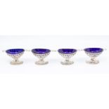 A set of four Georgian Neo-Classical style silver two handled oval ogee shaped salts, beaded rims