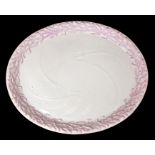Irish Interest:  A Belleek 2nd Period Echinus shaped tray, raised coral to border picked in pink,