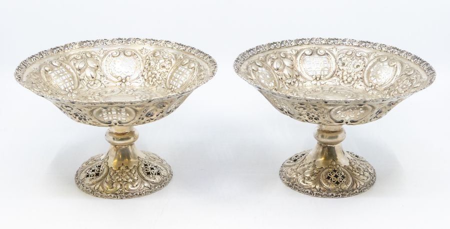 A pair of late Victorian silver tazze / bowls, shaped circular with openwork scrolling borders,