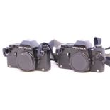 Pentax: A pair of Pentax LX SLR Camera bodies, Serial No. 5234056 and 5279023; together with three