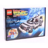 Lego: A boxed Lego Back to the Future, 21103, DeLorean, sealed. Signed by Thomas Wilson (Biff) and