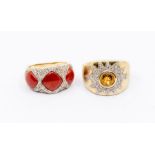 A 9ct gold citrine and diamond dress rings, comprising a round rub over set citrine within a star