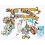 A collection of Egyptian themed jewellery to include white metal pendants and earrings, base metal