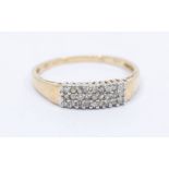 A diamond and 9ct gold dress ring, comprising three rows of small brilliant cut diamonds, width