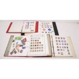 Stamps in four albums with a good collection of post Revolution China, Hungary and worldwide