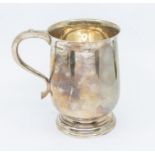 A George VI large silver plain baluster tankard, hallmarked by Finnegans, Sheffield, 1939, stamped