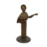Spelter mantel candlestick in the shape of an Edwardian lady playing a guitar-style instrument.