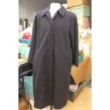 An Aquascutum 100% cashmere Black Coat. Made in England, 4 buttons, mid calf length. Size 14/16.