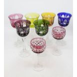 A set of six harlequin hock glasses, engraved and flashed bucket shaped bowls, faceted tapering