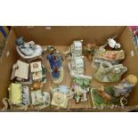 Collection of miniature Coalport cottages, Lladro figure, Staff figures, along with Capo del Monte