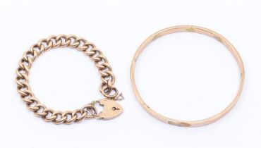 A 9ct gold slave bangle and 9ct gold hollow link curb bracelet with padlock clasp, combined total