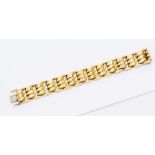 A 14ct gold fancy link bracelet comprising three central rows of faceted domed links within a border