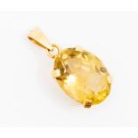A citrine and unmarked yellow metal  pendant, set with an oval cut citrine approx. 19 x 14mm, claw