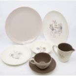 Large quantity of Poole Pottery mushroom glazed items including dinner plates, cups and saucers,