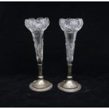 A pair of cut glass with hallmarked silver base