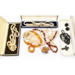 A collection of costume jewellery to include a multi row fresh water pearl necklace with 9ct gold