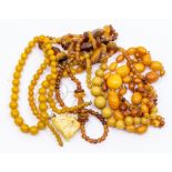 A collection of bead necklaces, to include two Baltic amber type necklaces one with alternate