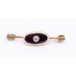 An early 20th century enamel and diamond unmarked yellow metal brooch, oval purple guilloche