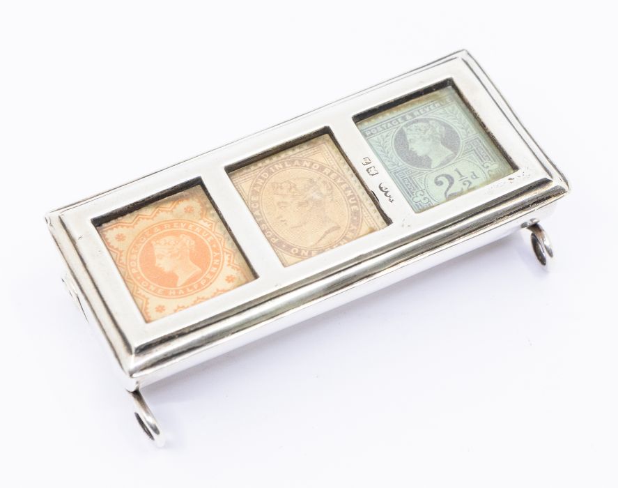 A Victorian silver triple compartment stamp box with half penny vermillion, one penny in lilac and