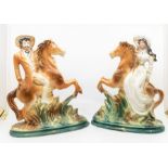 A pair of early 20th century Staffordshire figures of Buffalo Bill and Annie Oakley on horseback.
