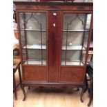 An Edwardian display cabinet in mahogany Condition report: crack to one glass panel