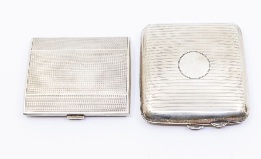 A George V silver engine turned cigarette case, hallmarked by D&F., Birimingham, 1926 together