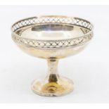 A George V silver raised bon bon dish with gallery rail, trumpet foot, hallmarked by William