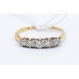 A diamond and 18ct gold five stone ring, comprising a graduated row of claw set old cut diamonds,
