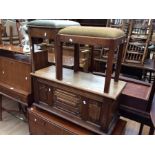 A mid 20th Century blanket/linen box with carved panels along with two piano stools