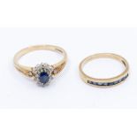 A sapphire and diamond 9ct gold cluster ring, set to the centre with a claw set oval cut sapphire