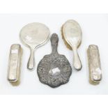 An Edwardian silver mounted dressing brush set and mirror, mottled bodies engraved with monogram,