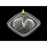 A Lalique 'Le Baiser' glass pendant, diamond shaped form with reverse intaglio depicting a kissing