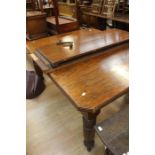 A Victorian oak wind-out table; with two extra leaves, on castors, length 150 cm, width 120cm,
