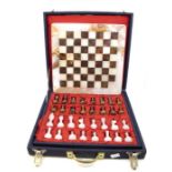 A boxed hardstone complete chess set, appears unused