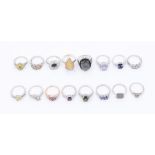 A collection of sixteen Gems TV gem set silver rings to include, a multicolored sapphire dress ring,