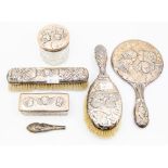 An early 20th Century silver mounted dressing table set, all chased with Reynold's Angels.,
