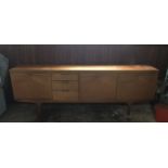 SCANDINAVIAN DESIGN: A large teak sideboard with a length of 220 cms (7'2") the legs set in just