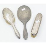 A group of early 20th Century silver mounted dressing table items to include: mirror and two
