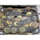 Collection of late 19th/early 20th Century horse brasses mounted on leather martingale straps