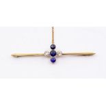 An Edwardian diamond and sapphire bar brooch, comprising a central line round cut sapphires (one