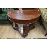A Victorian mahogany demi-lune hall table with lift up drawer top Condition: No apparent signs of